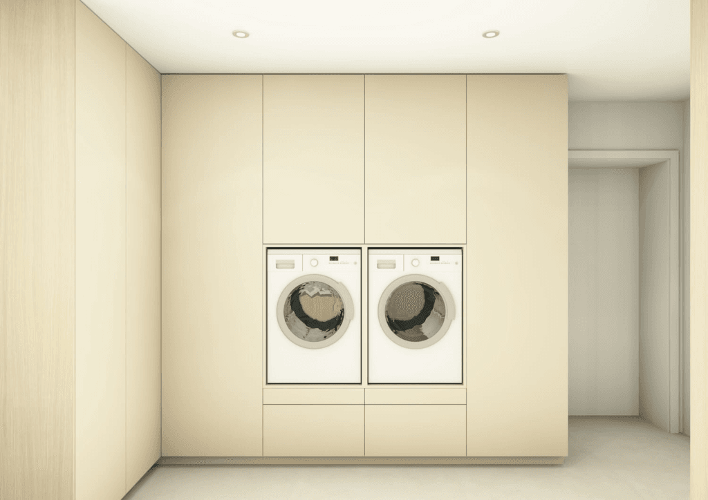 ingebouwde wasruimte met maatkasten in licht hout en wasmachine en droogkast 