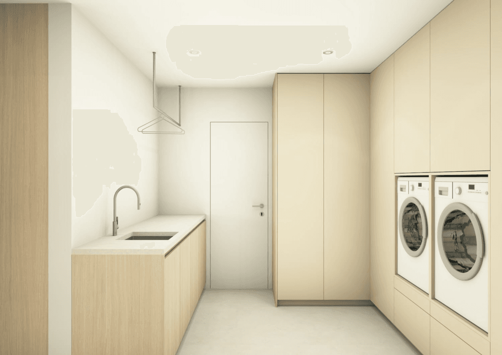 wasruimte met ingebouwde wasmachine en droogkast en lichthouten kasten